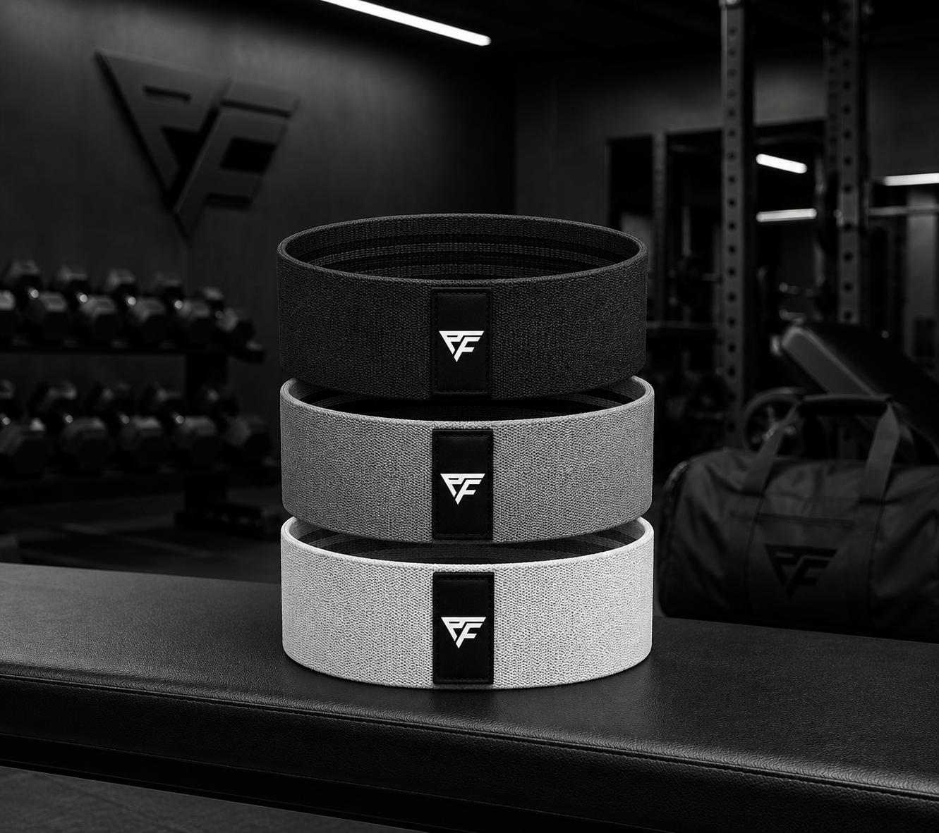 Piero Fitness PT branded fabric resistance bands in three strengths.