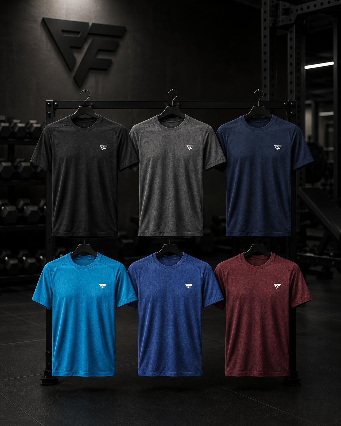Piero Fitness PT branded training tees in six colours on a gym rack.